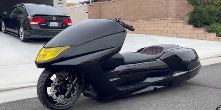 Black GILMADE custom scooter, front angle