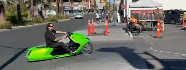 Green custom scooter at an event
