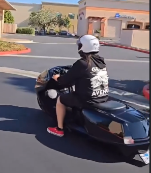 A GILMADE scooter being ridden